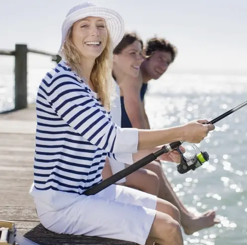 Woman fishing in Denmark